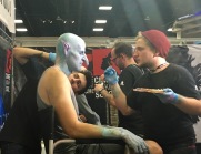 Winner of the SyFy show "Face Off" doing some makeup on the spot.